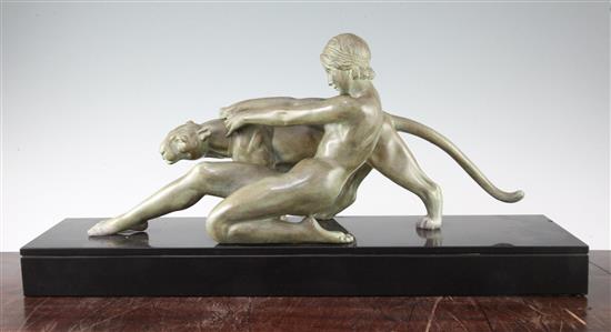 A. Ouline. A bronzed metal group of a nude woman and panther, 23.75in.